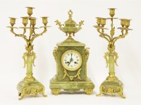 Lot 440 - An onyx and gilt bronze mounted clock garniture