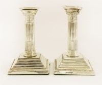 Lot 69 - A pair of late Victorian silver column candlesticks