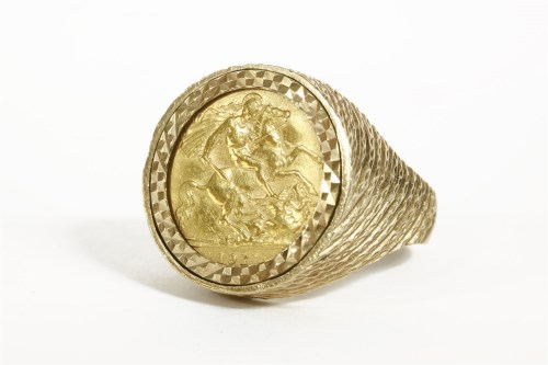 Lot 1019 - A 1911 half sovereign in a 9ct gold ring mount
12.77g