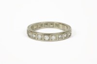 Lot 1011 - A white gold diamond half eternity ring