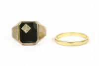 Lot 1027 - A gentleman's 9ct gold diamond set onyx signet ring