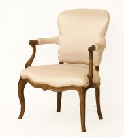 Lot 1754 - A French walnut carved open armchair