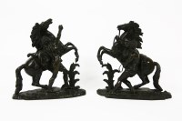 Lot 1406 - A pair of bronze Marley horse ornaments