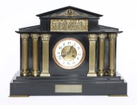 Lot 121 - An Edwardian black marble mantel clock
