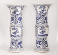 Lot 9 - A pair of Chinese export ware blue and white gu form vases