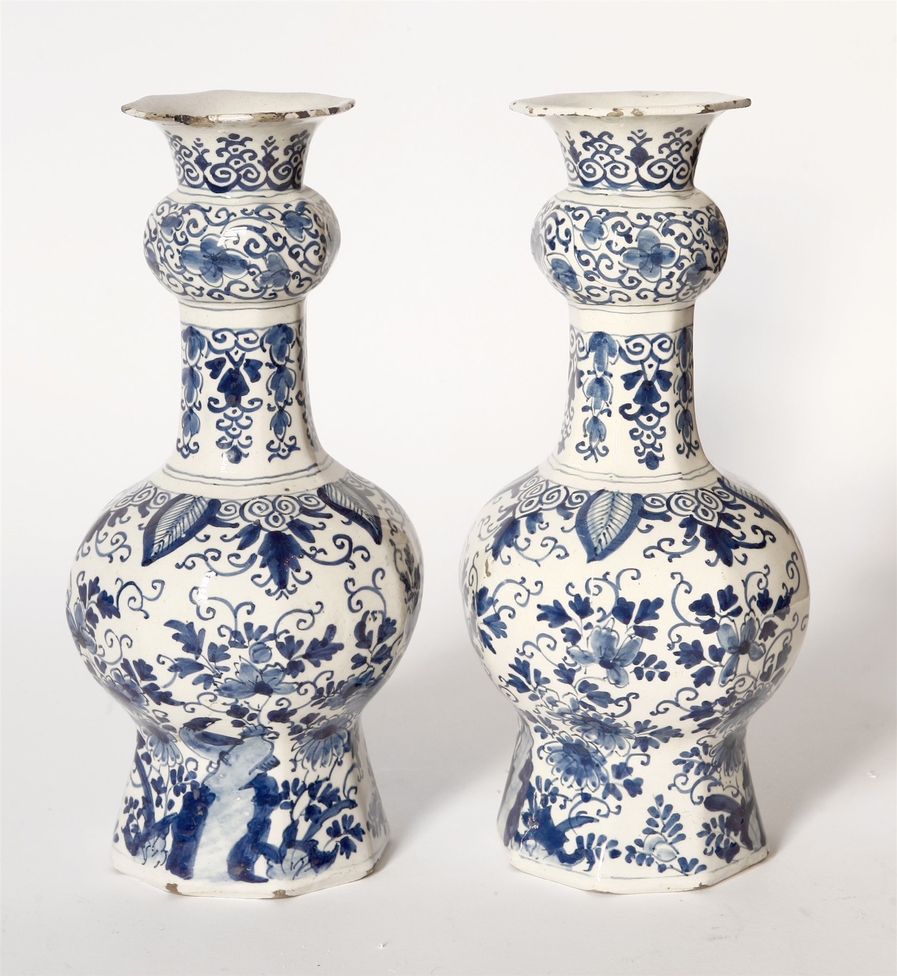 Lot 76 A pair of delft blue and white vases