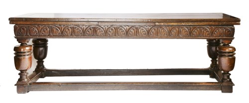 Lot 113 - A reproduction oak draw-leaf refectory table