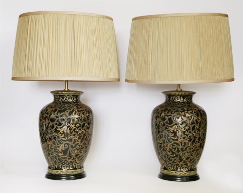Lot 98 - A pair of decorative black-glazed and gilt-decorated pottery vase-shaped electric lamp bases
