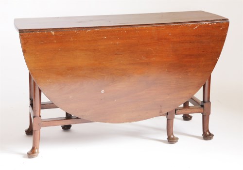 Lot 185 - An oval mahogany drop-leaf table