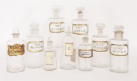 Lot 196 - A collection of nine glass apothecary's jars and stoppers