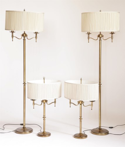 Lot 200 - A set of four slender brass lamp standards