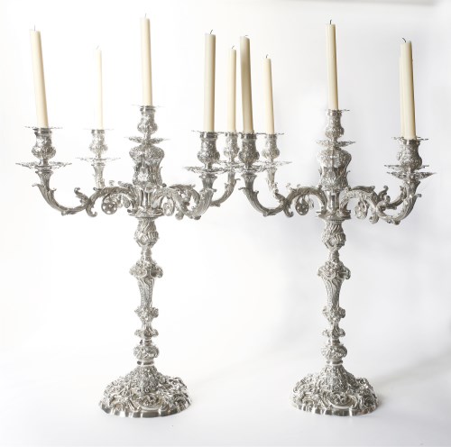 Lot 269 - A pair of impressive George IV silver five-light candelabra with royal arms