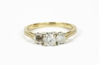 Lot 1015 - An 18ct gold three stone diamond ring