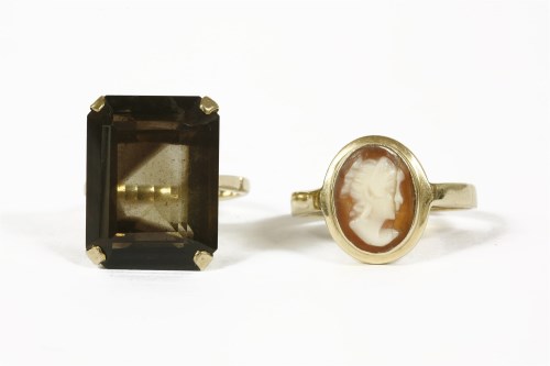 Lot 1007 - A 9ct gold emerald cut smokey quartz ring