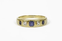 Lot 1038 - A gold graduated five stone sapphire and diamond ring