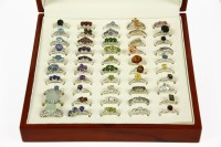 Lot 1101 - A presentation ring box containing 50 assorted silver gem set rings with authenticity cards