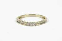 Lot 1070 - A 9ct white gold three stone princess cut diamond ring