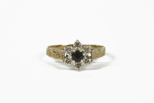 Lot 1048 - A 9ct gold sapphire and diamond cluster ring