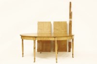 Lot 1614 - A Biedermeier style satinwood dining table