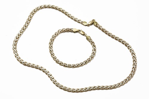 Lot 1031 - A 9ct two colour gold fancy 'S' link chain necklace