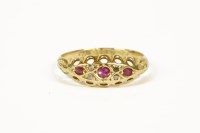Lot 1016 - An 18ct gold ruby and diamond boat shaped ring