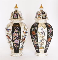 Lot 30 - A pair of Meissen-style vases and covers