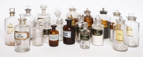 Lot 35 - A collection of glass drug jars and stoppers
