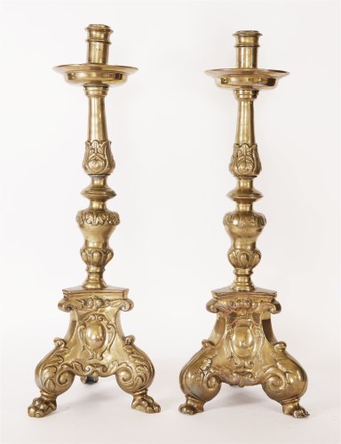 Lot 8 - A pair of heavy cast brass candlesticks