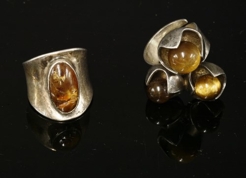 Lot 1032 - A sterling silver Finnish three stone tiger's eye ring by Solovair Turku (1950 -1988)