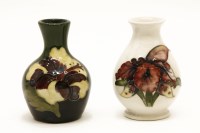 Lot 1216 - Two squat Moorcroft vases Iris and Hibiscus patterns