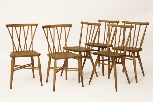 Lot 1705 - A set of four Ercol light elm dining chairs