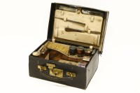 Lot 1123 - An early 20th century Asprey silver lady's part travel dressing set