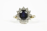 Lot 1093 - A 9ct gold sapphire and diamond oval cluster ring