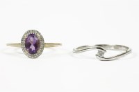 Lot 1087 - A 9ct gold amethyst and diamond cluster ring