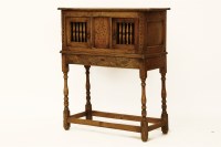 Lot 1646 - A 18th century style oak glass cupboard on stand