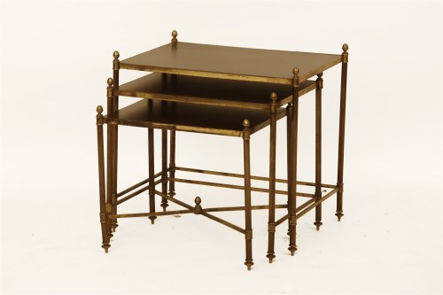 Lot 1801 - A nest of three brass tables
