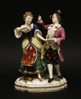 Lot 1226 - A 19th century Chelsea design porcelain figure group of a man and woman in traditional costume