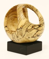Lot 192 - A spherical burr wood sculpture