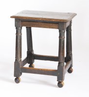 Lot 57 - An oak joined stool