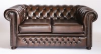 Lot 53 - A modern brown leather two-seat chesterfield settee