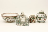 Lot 1245 - A Chinese polychrome porcelain model of a happy Buddha