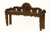 Lot 1746 - A Victorian oak window seat with carved scroll ends and supports