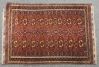 Lot 1755 - A Persian Bokhara design rug