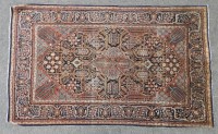 Lot 699 - A Persian blue ground rug