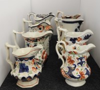 Lot 377 - A collection of ten Gaudy Welsh jugs of varying designs and sizes