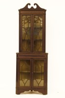 Lot 658 - An Edwardian strung and crossbanded standing corner cabinet