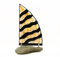 Lot 339 - A multi coloured glass sail sculpture on stone base