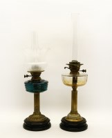 Lot 331 - A Victorian cast metal oil lamp with blue glass reservoir and etched glass shade