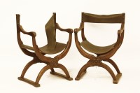 Lot 667 - A pair of Continental walnut x-framed open armchairs