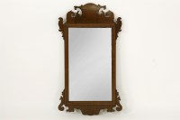 Lot 575 - A fret framed walnut wall mirror. 83cm high